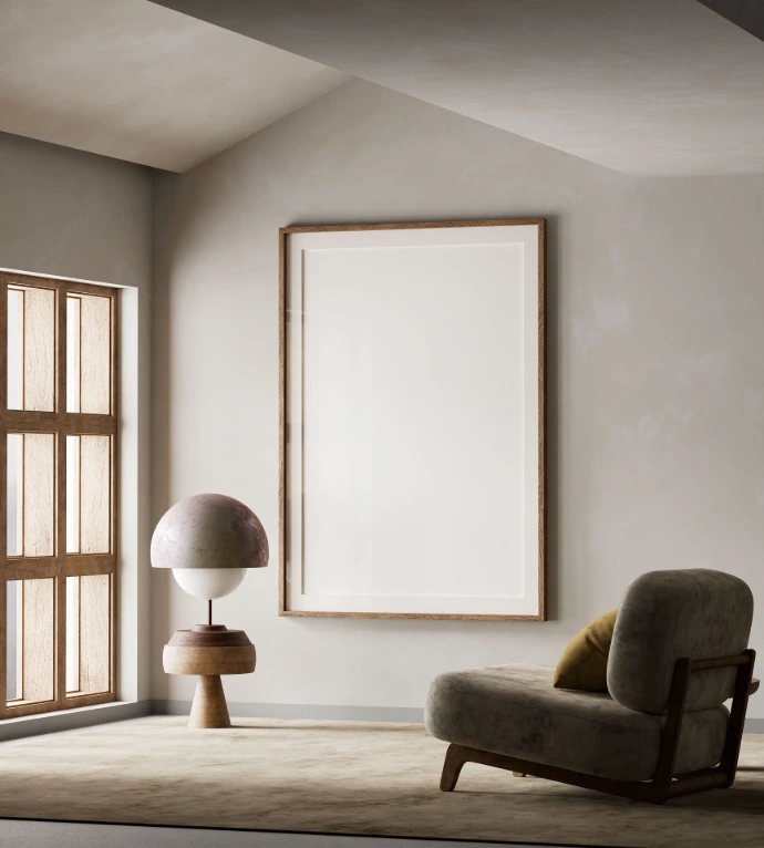 A peaceful, minimalist stone interior room with a single arched window letting in warm, soft sunlight illuminating an empty armchair and a blank vertical canvas.