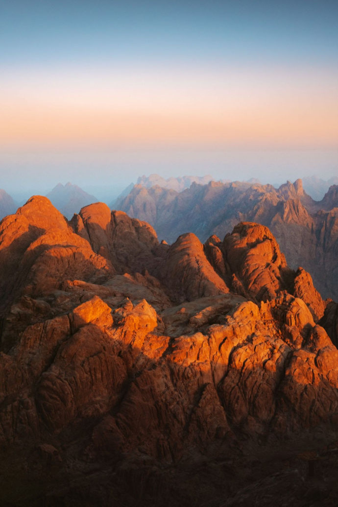 Minimalist landscape sunrise over the jagged peaks of Mount Sinai