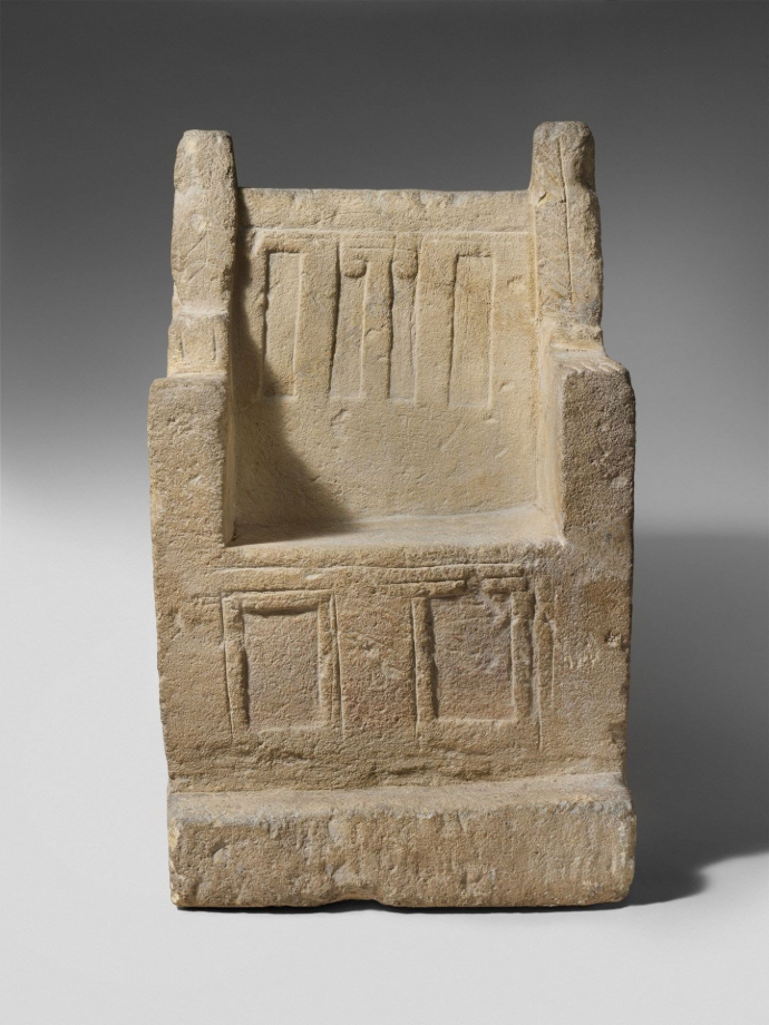 A full view of an ancient Cypriot limestone votive throne artifact, dating to the Archaic period of the 6th century BC, symbolizing the sovereign seat and historical authority of the Daudic line.