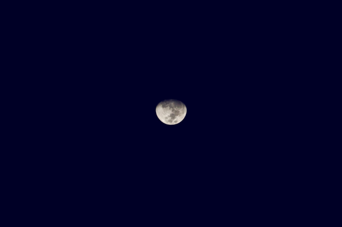A detailed close-up of a bright full moon shining in a dark night sky, illustrating mweri as an ordained statutory instrument governing time and sacred seasons in the Old Testament.