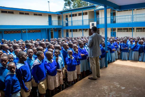 receive instructions from the school's principal prior to the Kenya Certificate of Primary Education (KCPE) exam on October 31, 2017 in Nairobi, following a return to daily life after turmoil caused by Kenya's presidential re-election vote.